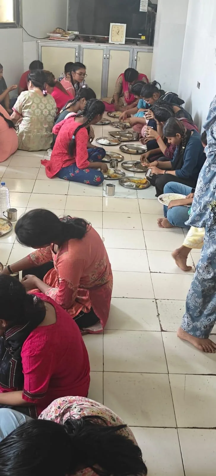Children eating a rescued meal together at a partner site