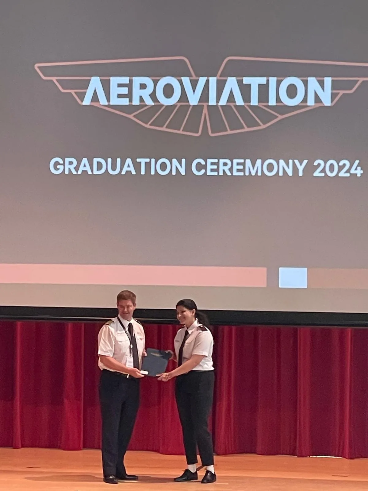 Riya receiving her ground-school certificate at the Aeroviation Academy graduation ceremony, 2024